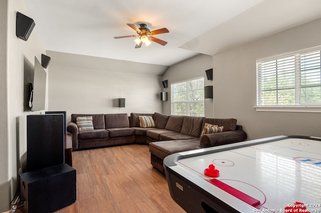 playroom featuring lofted ceiling, ceiling fan, and light wood-type flooring