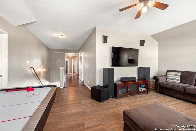 interior space with hardwood / wood-style floors, vaulted ceiling, and ceiling fan