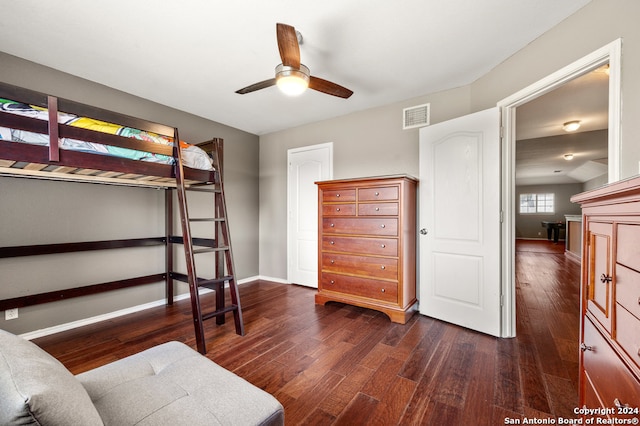 bedroom with ceiling fan and dark wood-type flooring