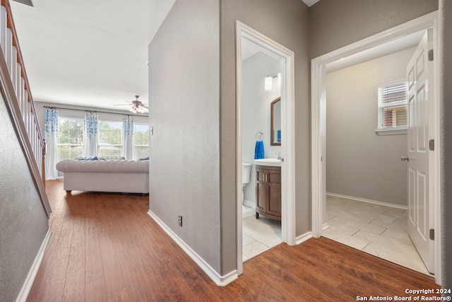 hall with sink and hardwood / wood-style flooring