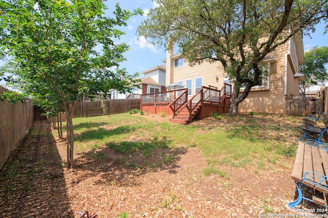 view of yard with a deck