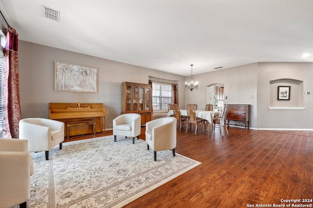 living room featuring a chandelier and hardwood / wood-style flooring