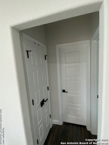 hallway featuring dark hardwood / wood-style floors