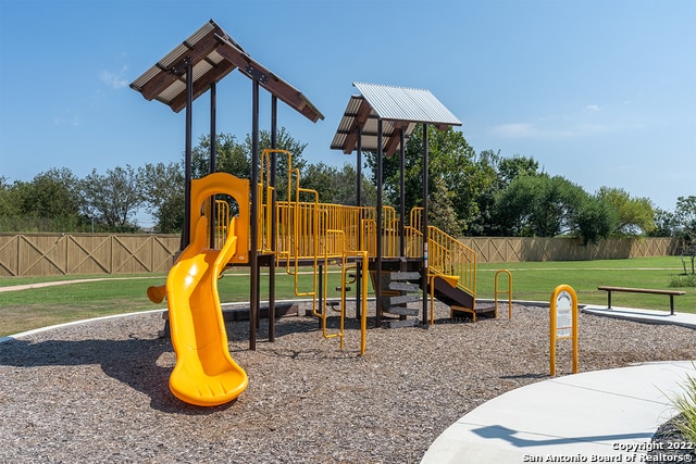 view of jungle gym with a lawn