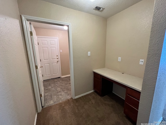 bathroom featuring a textured ceiling