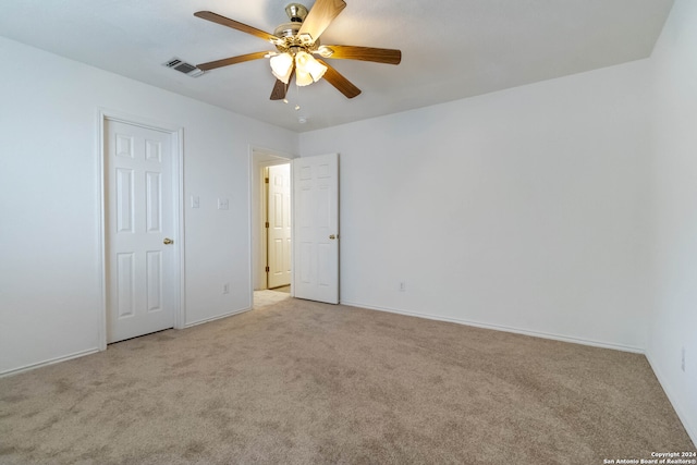 unfurnished bedroom featuring ceiling fan and light colored carpet