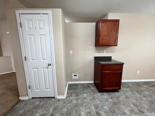 kitchen featuring a textured ceiling