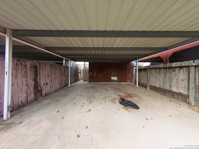 garage featuring a carport