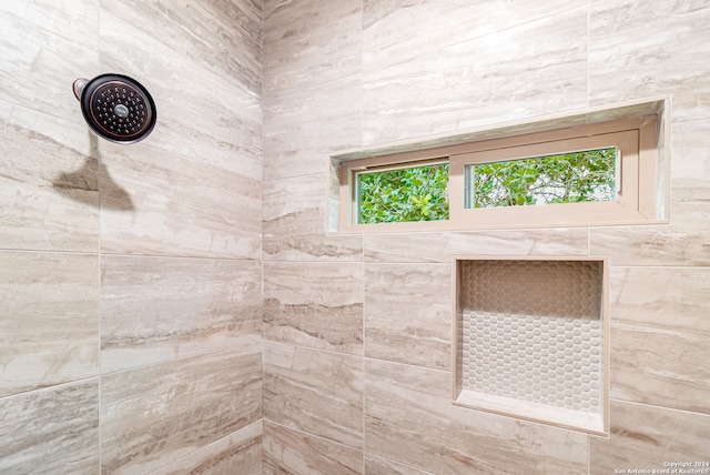 bathroom featuring tiled shower