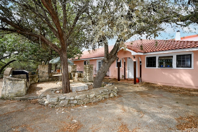 view of front facade with a patio area