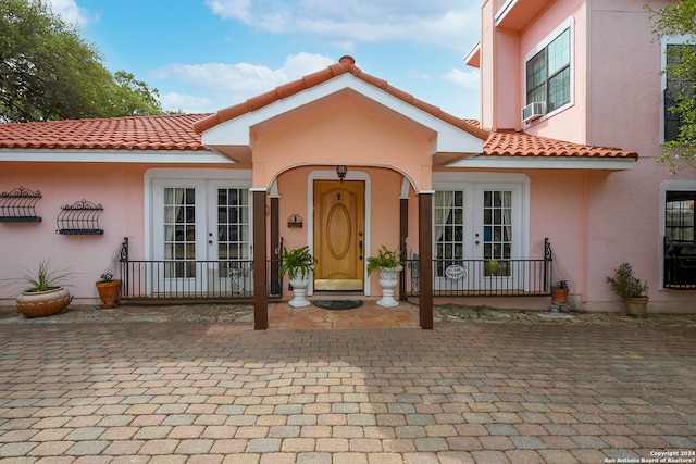 mediterranean / spanish-style house featuring french doors