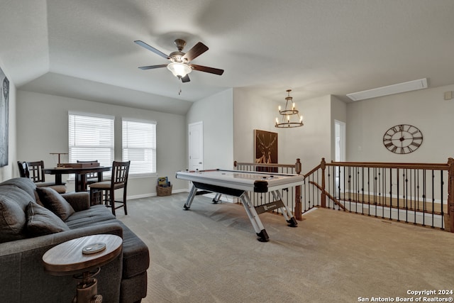 rec room featuring ceiling fan with notable chandelier, carpet floors, and vaulted ceiling