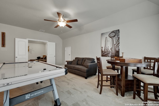 playroom with lofted ceiling, ceiling fan, and light colored carpet