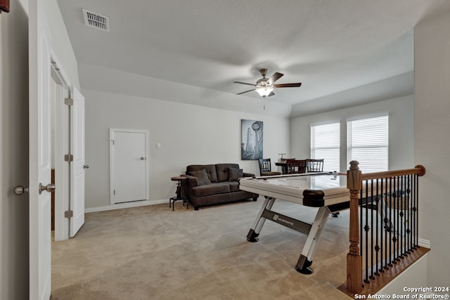 interior space with light colored carpet and ceiling fan