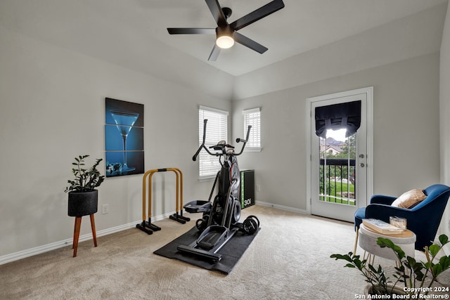 workout room featuring light carpet and ceiling fan