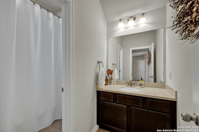 bathroom with vanity and tile floors