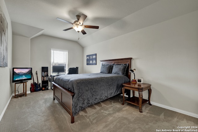 carpeted bedroom with vaulted ceiling and ceiling fan