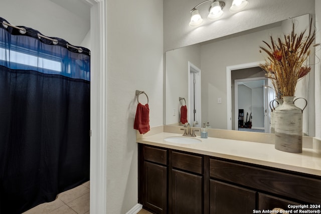 bathroom featuring tile floors and vanity