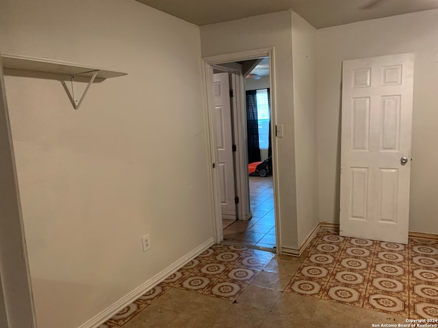 spare room featuring tile floors