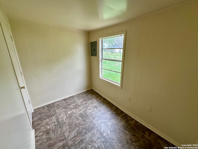 empty room featuring dark tile flooring