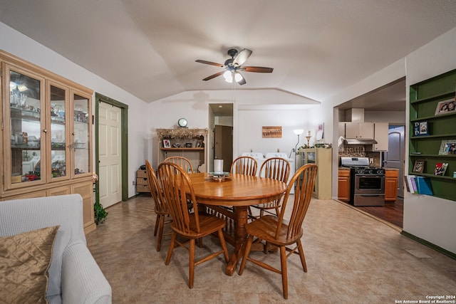 dining room with tile flooring, ceiling fan, and lofted ceiling