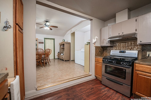 kitchen featuring washer / dryer, ceiling fan, backsplash, and stainless steel gas range oven