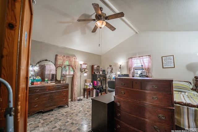 tiled bedroom with a textured ceiling, ceiling fan, and vaulted ceiling with beams