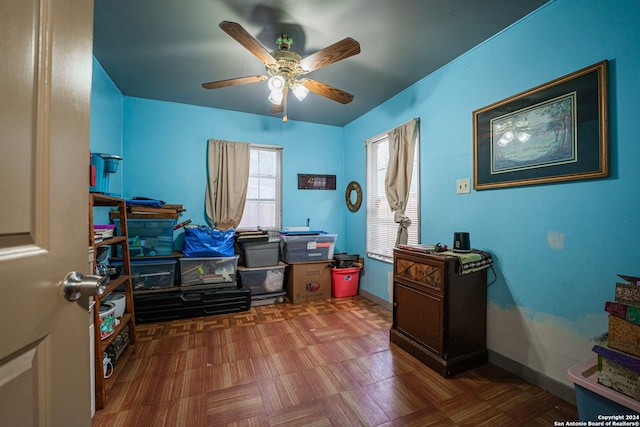 interior space with ceiling fan