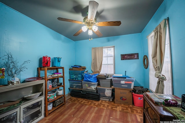 interior space with ceiling fan