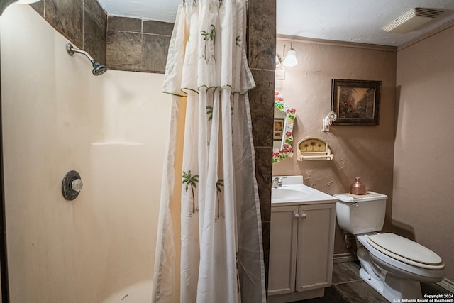 bathroom featuring oversized vanity, crown molding, toilet, and tile floors