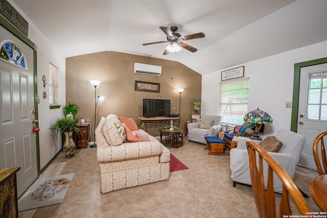 tiled living room with vaulted ceiling, ceiling fan, a healthy amount of sunlight, and a wall mounted air conditioner