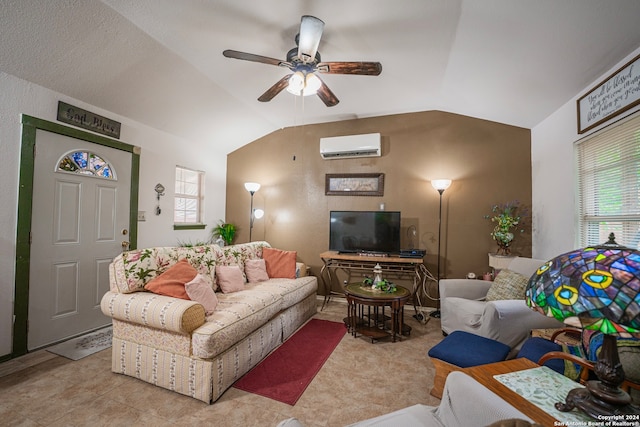 living room featuring an AC wall unit, tile flooring, ceiling fan, and vaulted ceiling