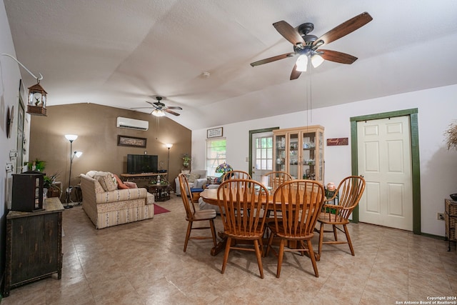 tiled dining room with vaulted ceiling, ceiling fan, and an AC wall unit