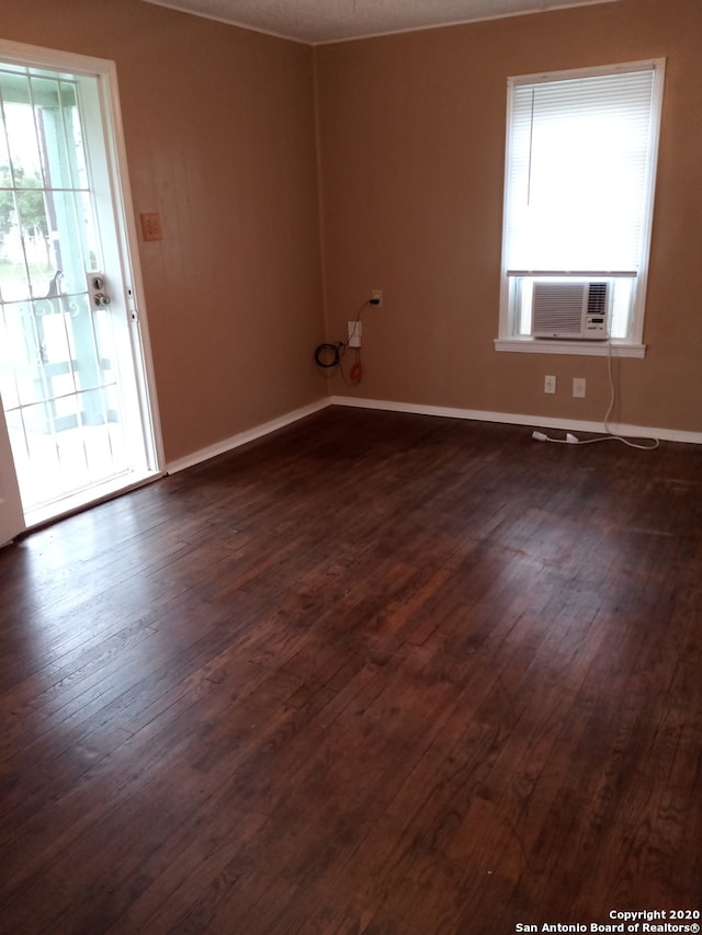 unfurnished room featuring dark hardwood / wood-style floors