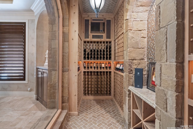 wine room with ornamental molding