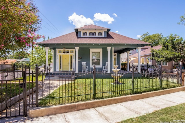 view of front of house featuring a porch and a front lawn