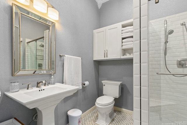 bathroom with a textured ceiling, tile floors, an enclosed shower, sink, and toilet