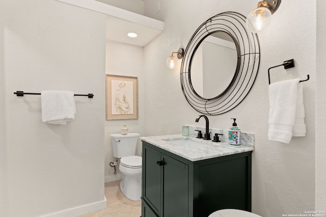 bathroom with tile floors, toilet, and large vanity