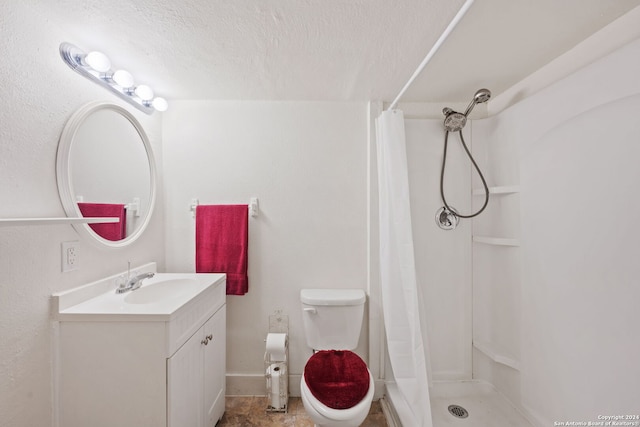 bathroom with oversized vanity, a shower with shower curtain, toilet, tile flooring, and a textured ceiling