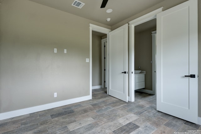 unfurnished room featuring wood-type flooring and ceiling fan