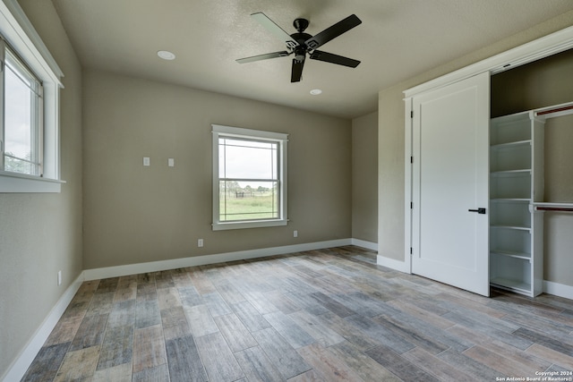 unfurnished room with light hardwood / wood-style floors and ceiling fan