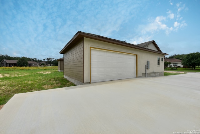 garage featuring a yard