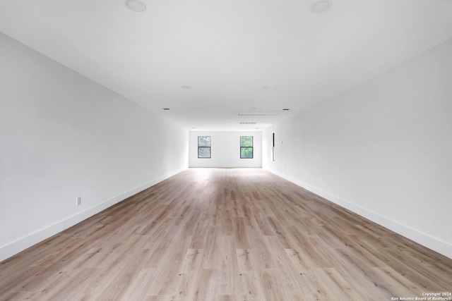 spare room with light hardwood / wood-style flooring