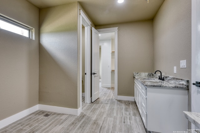 bathroom featuring vanity and hardwood / wood-style floors