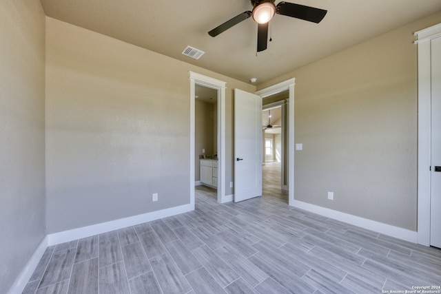 exterior space featuring ceiling fan and ensuite bathroom