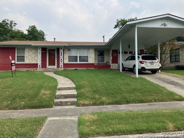 ranch-style home with a front lawn and a carport