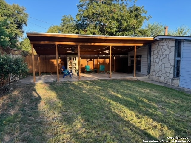 back of house with a yard