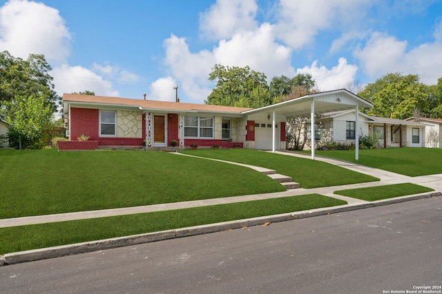 ranch-style home with a garage, a carport, and a front yard