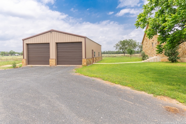 garage with a lawn