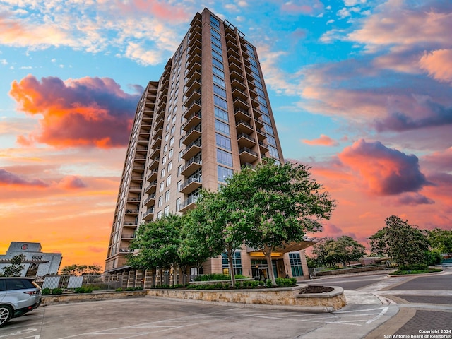 view of outdoor building at dusk